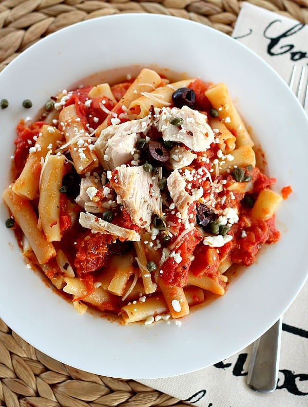 Tuna with Simple Pasta sauce is complex and satisfying. Pasta gets simmered in the sauce for slow-simmer flavor. Two cheeses, red pepper flakes, capers and olives.
