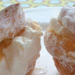 cream puffs with whipped cream and powdered sugar