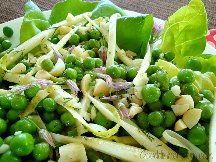 Close up of Butter Salad with peas, cheese and blossoms 