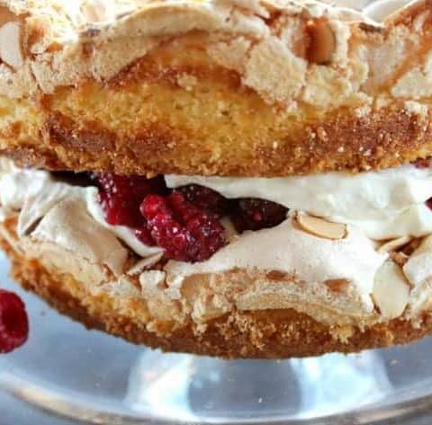 blitz torte with whipped cream and raspberries