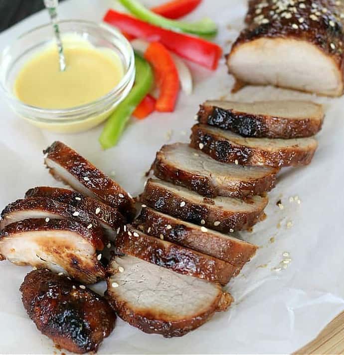 char siu pork with mustard and sliced bell peppers on side