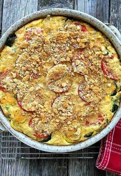 Zucchini and Summer Squash Casserole is baked with fresh basil, roma tomatoes and sweet corn. An excellent side dish or tasty vegetarian main course.