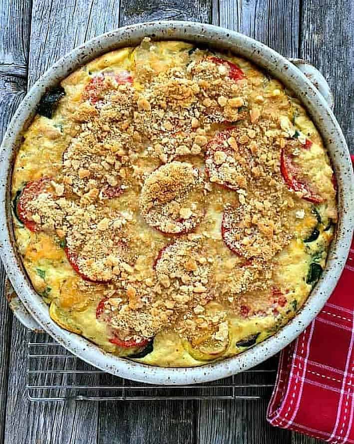 Zucchini and Summer Squash Casserole is baked with fresh basil, roma tomatoes and sweet corn. An excellent side dish or tasty vegetarian main course.