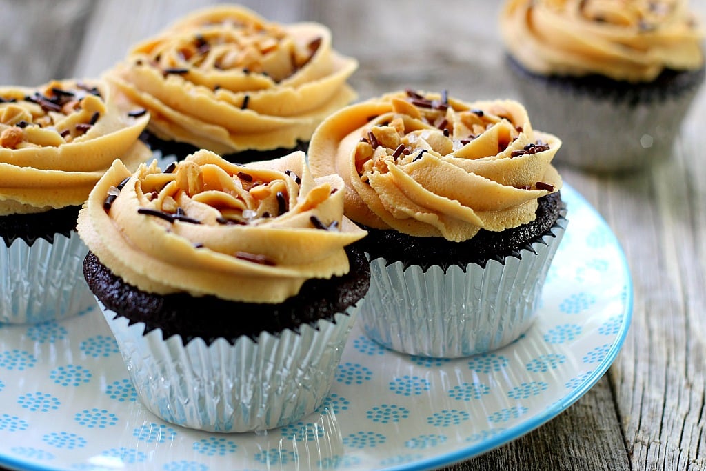 Chocolate Coca-Cola Cupcakes with Peanut Butter Butter frosting on a blue plate 