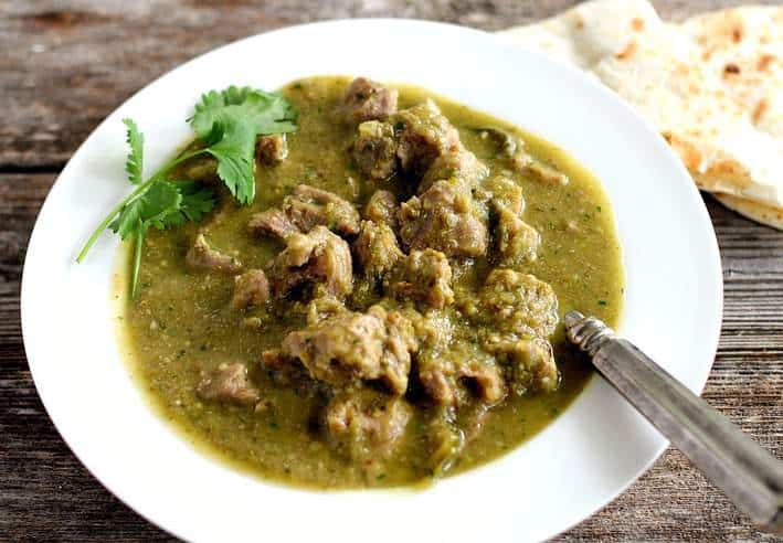 chile verde in white bowl.