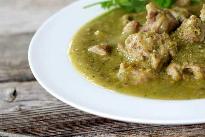 chile verde in white bowl.