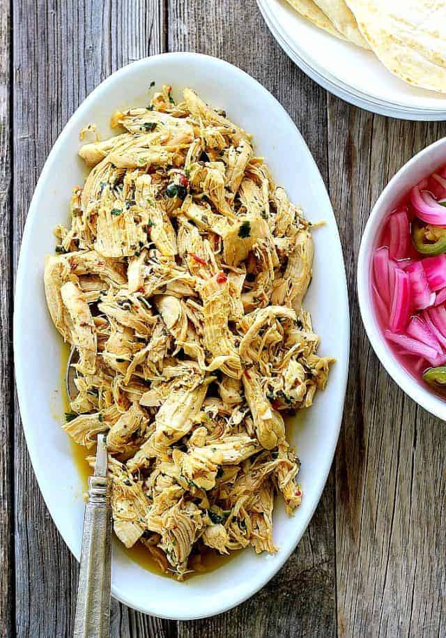 Easy Instant Pot Chicken Taco meat on white plate.