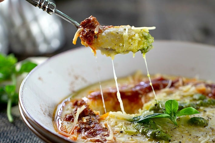 Polenta with melting cheese on a fork