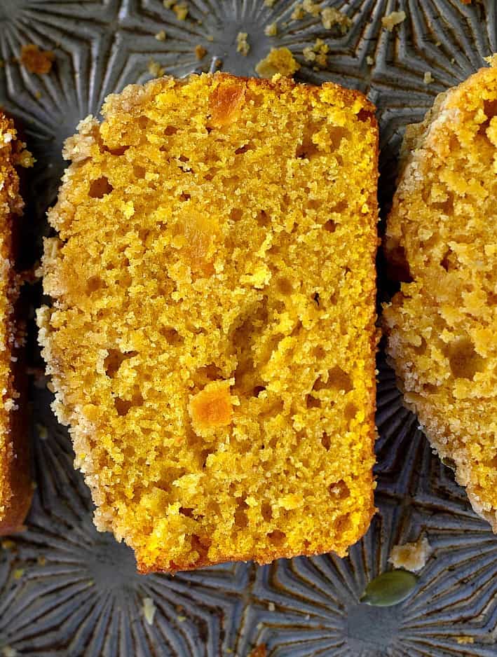 Close up of a slice of apricot pumpkin bread