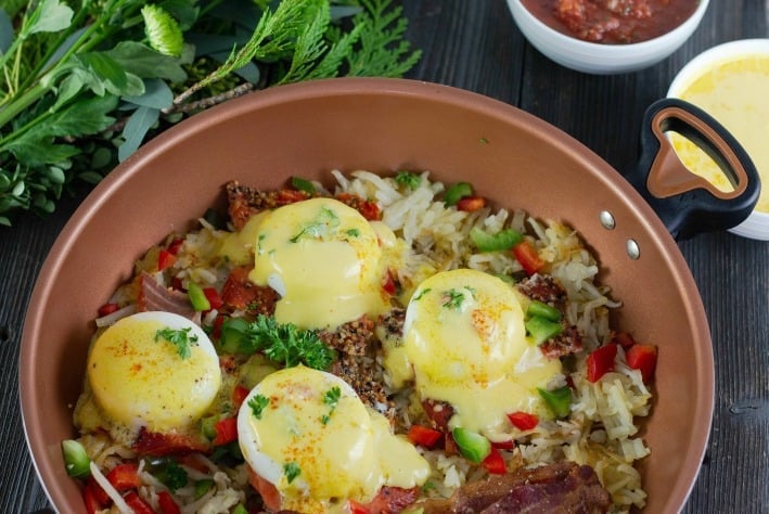 Eggs Benedict over Hash Browns. Super easy and special, served family style for perfect holiday breakfast made easy. #farberwarecook #eggsbenedict