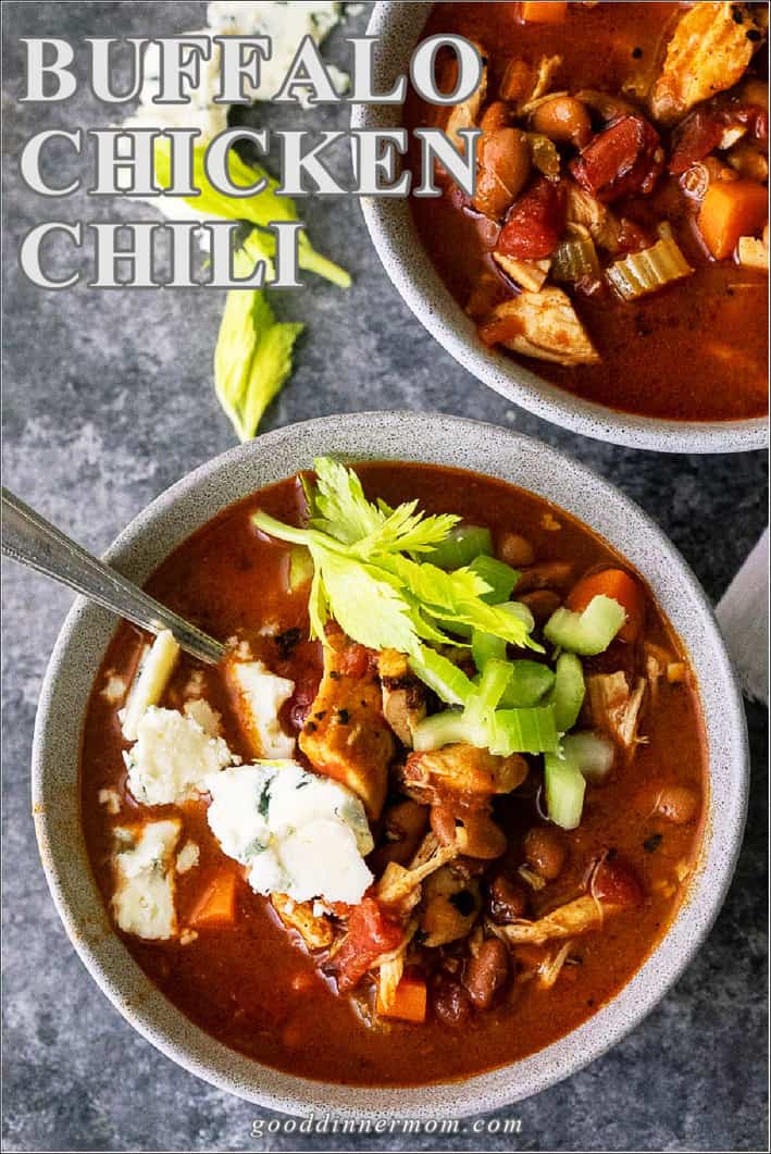Buffalo Chicken Chili in bowls with blue cheese and celery on top and beside bowl