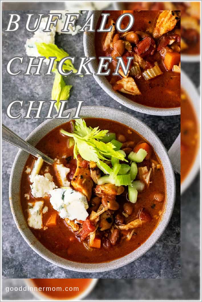Buffalo Chicken Chili in bowls with blue cheese and celery on top and beside bowl