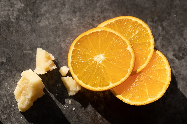 slices of orange and chunks of parmesan cheese