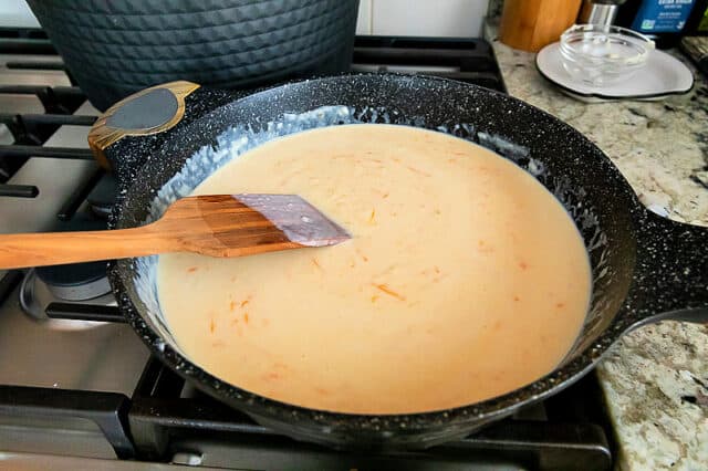 Sauce on stove after cheese has melted.