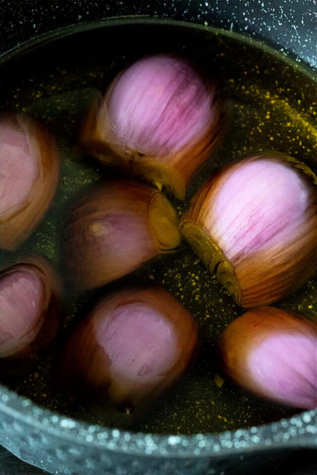 shallots in a pan with extra virgin olive oil