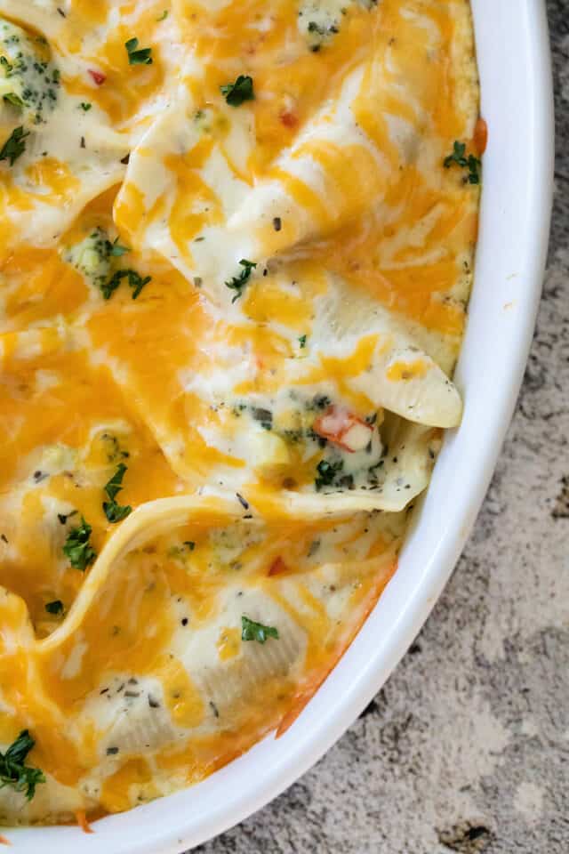 closeup of stuffed shells with melted cheese after baking