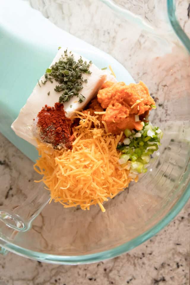 Pumpkin Cheddar Cheese ball ingredients in a bowl before mixing.