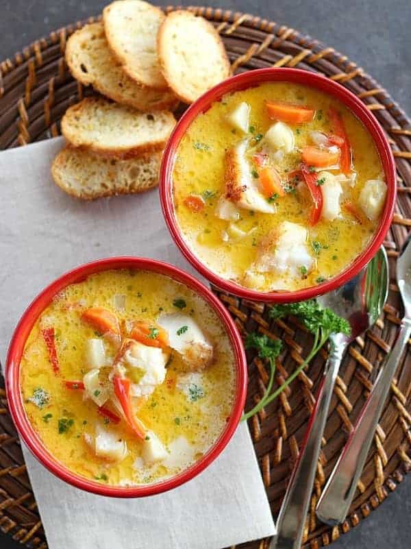 Baked Fish Chowder in bowls with bread on the side.
