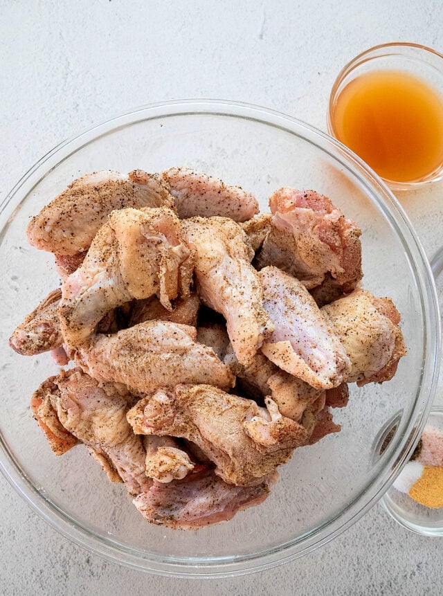 Wings dusted in salt, pepper, baking powder, and olive oil.