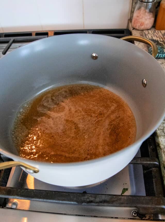 Vinegars, salt, sugar, pepper, garlic powder in a sauce pot.