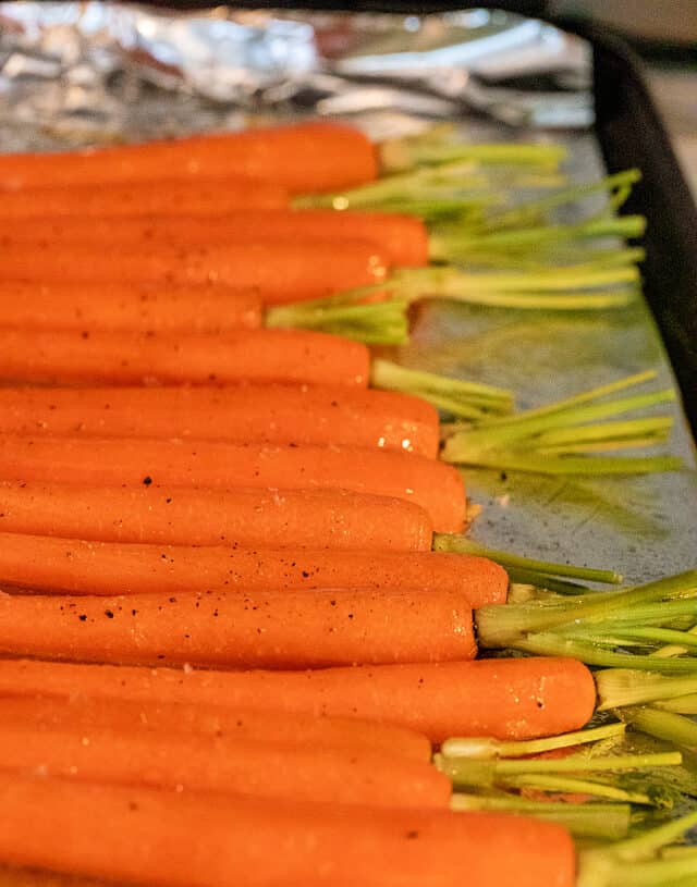carrots tossed with butter and seasoning before roasting