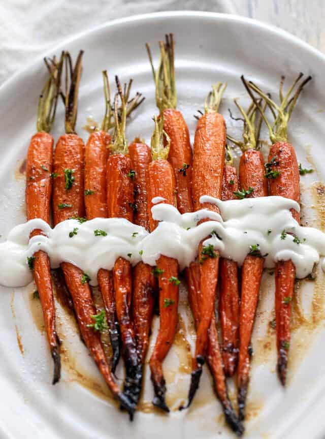 roasted carrots with sour cream drizzle and herbs