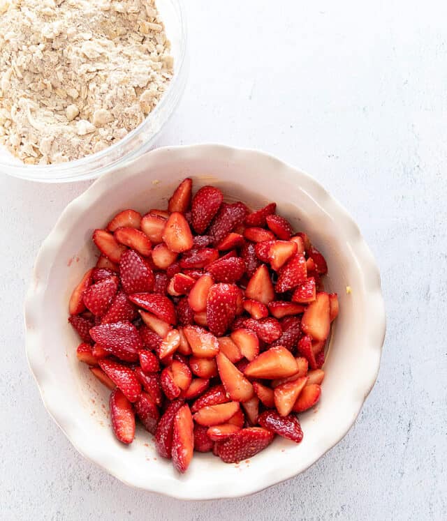 strawberry crisp filling in baking dish before topping