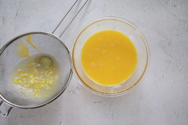 Lemon and egg mixture after straining through sieve.