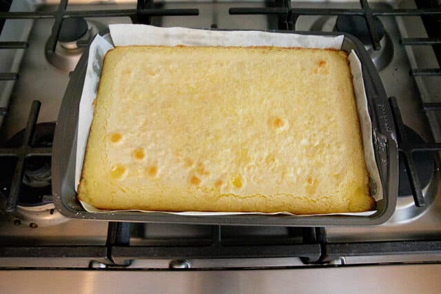 Lemon bars right out of oven before sprinkling with powdered sugar.