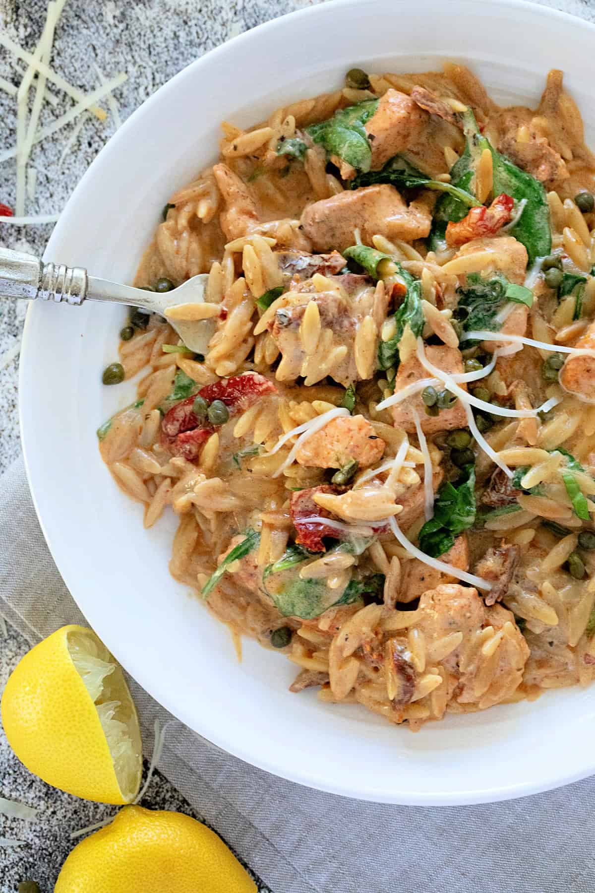One Pot Creamy Chicken Orzo in a white bowl.
