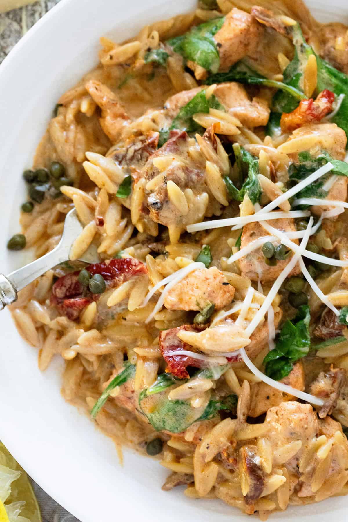 One Pot Creamy Chicken Orzo in a white plate.