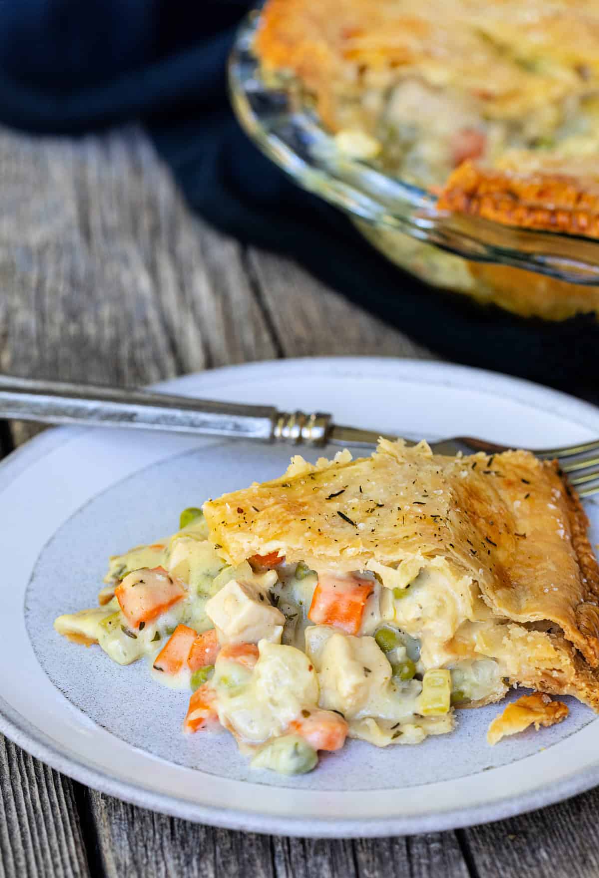 Slice of chicken pot pie on a plate.