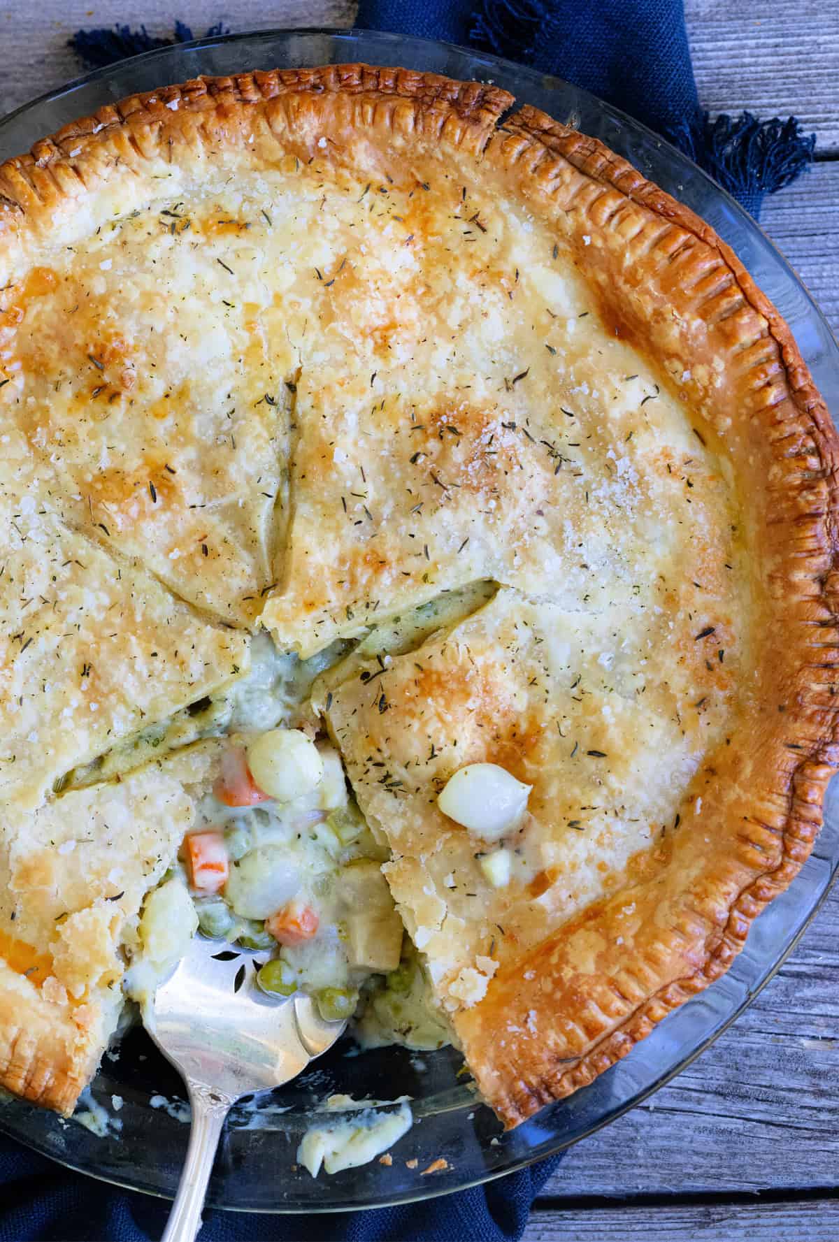 Closeup of chicken pot pie with slice cut out of it.