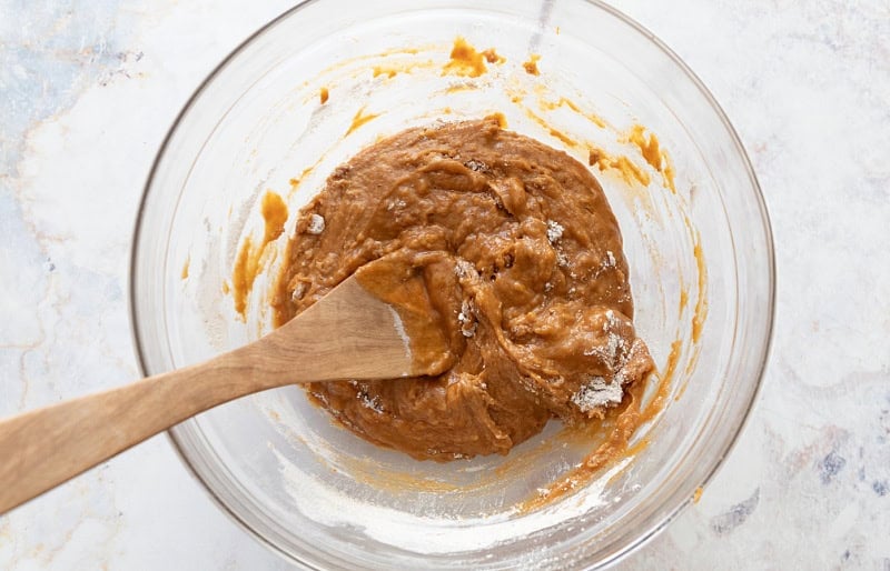 Pumpkin bread wet and dry ingredients almost fully combined.