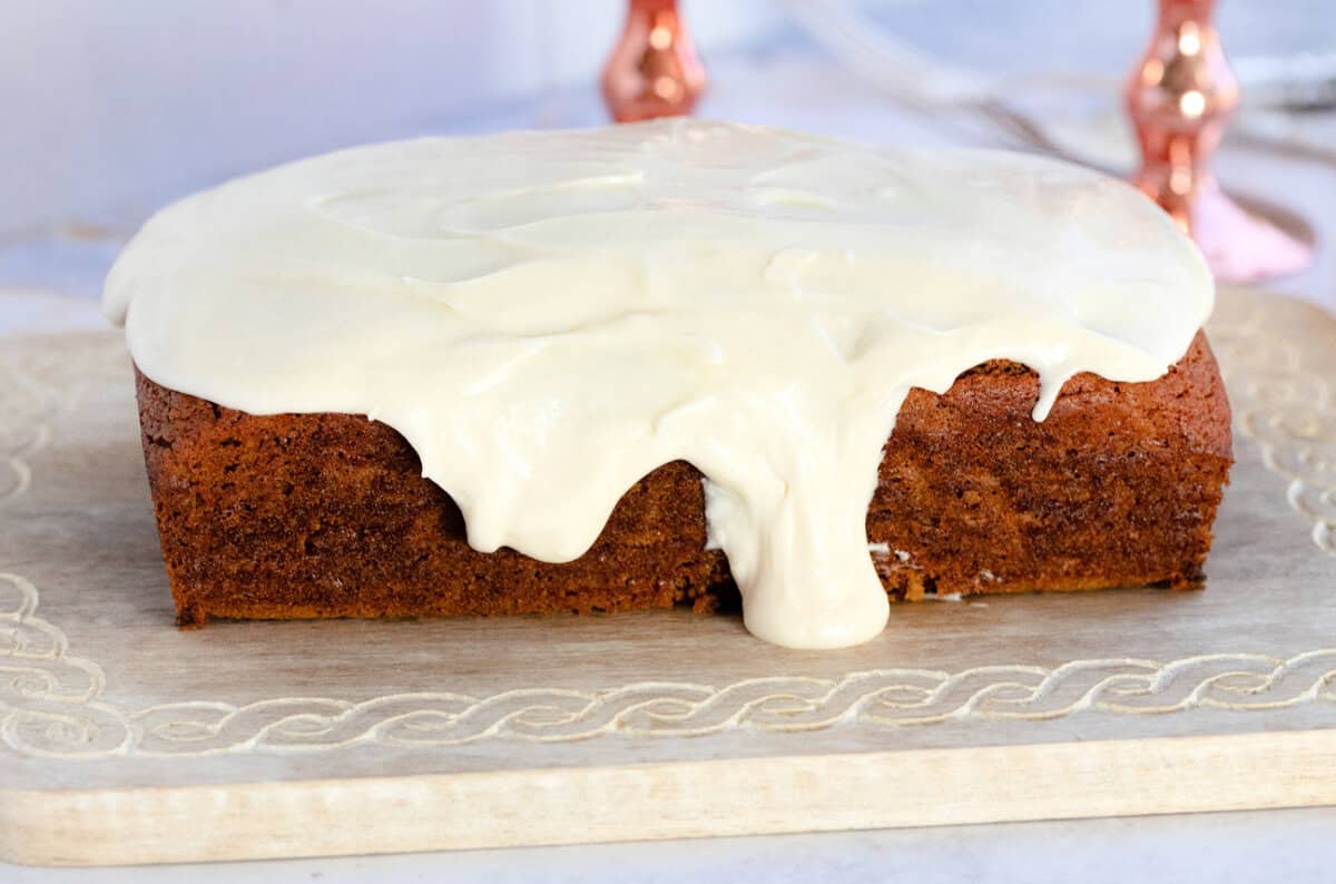 Side view of Pumpkin Bread with Cream Cheese Frosting.
