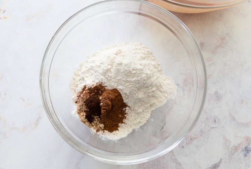 Dry ingredients for pumpkin bread: Flour, cinnamon, ginger, nutmeg, cloves.