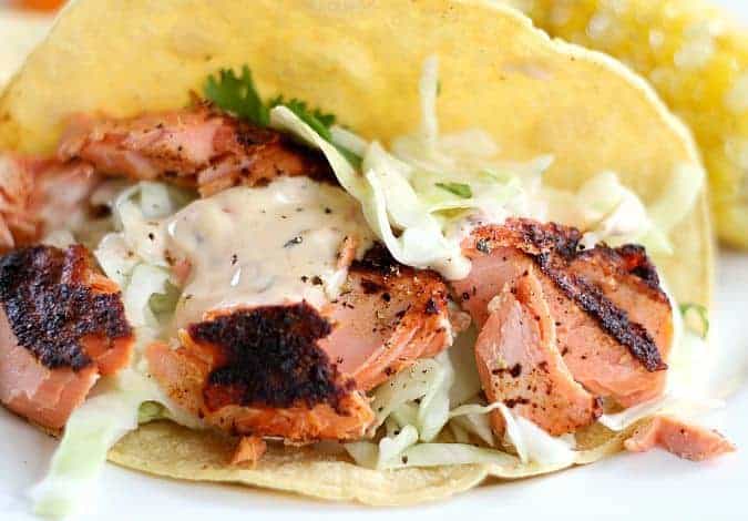 salmon tacos with cabbage and sauce