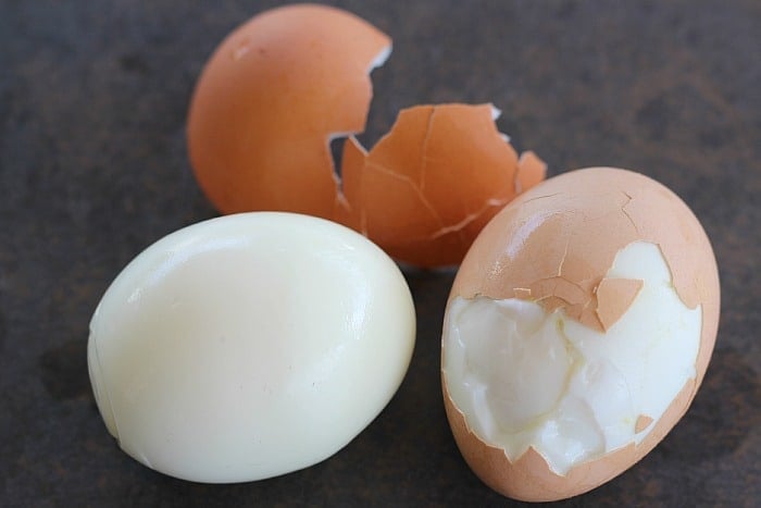  Hard Boiled Eggs being peeled 