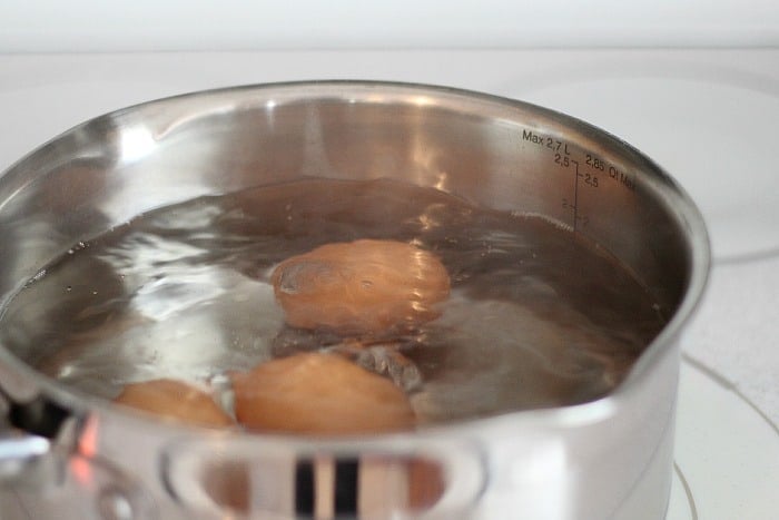Eggs boiling in a pan