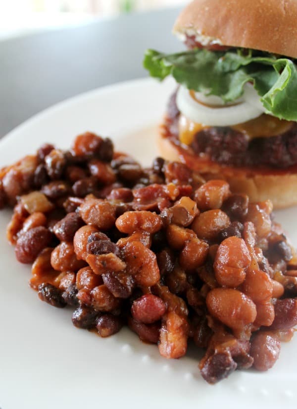  Baked Beans on a white plate serve with a burger