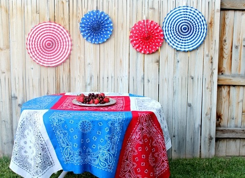 Red white and blue Bandana tablecloth on table, fruit in center 