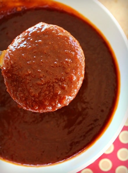 Barbecue Sauce on a spoon and some in a white bowl