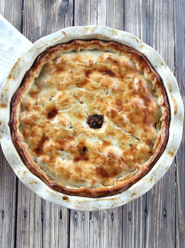 Top view of pot pie, baked in white pie dish