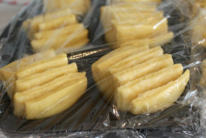 Butter fan rolls covered with plastic before baked