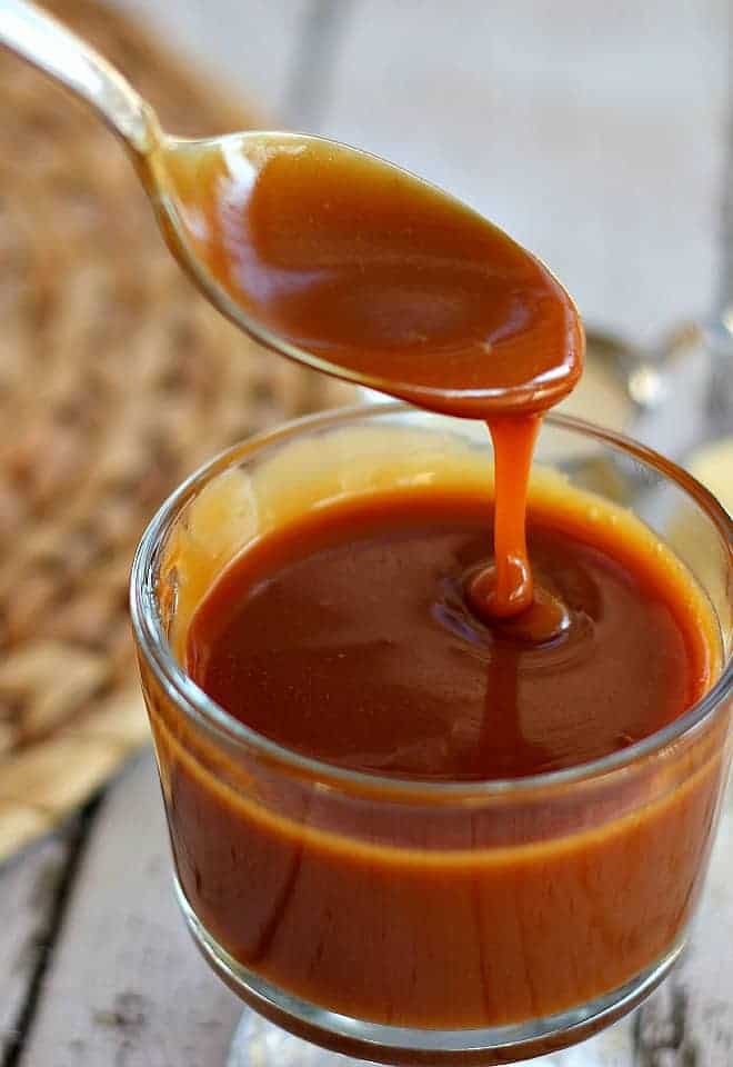 Caramel Sauce pouring off a spoon