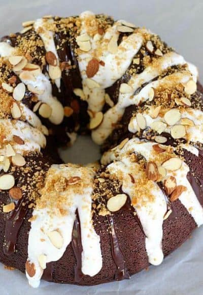 Chocolate S'mores Bundt Cake starts with a delicious, moist sour cream chocolate cake and builds from there with chocolate ganache and marshmallow cream.