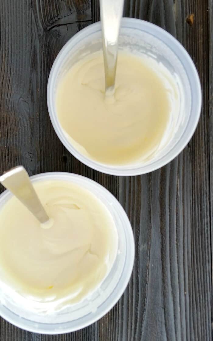 Creme Fraiche with spoons in two containers.
