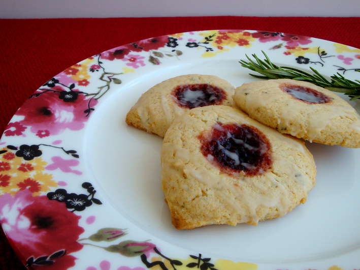 Three Rosemary Scones on a white and flowered plate