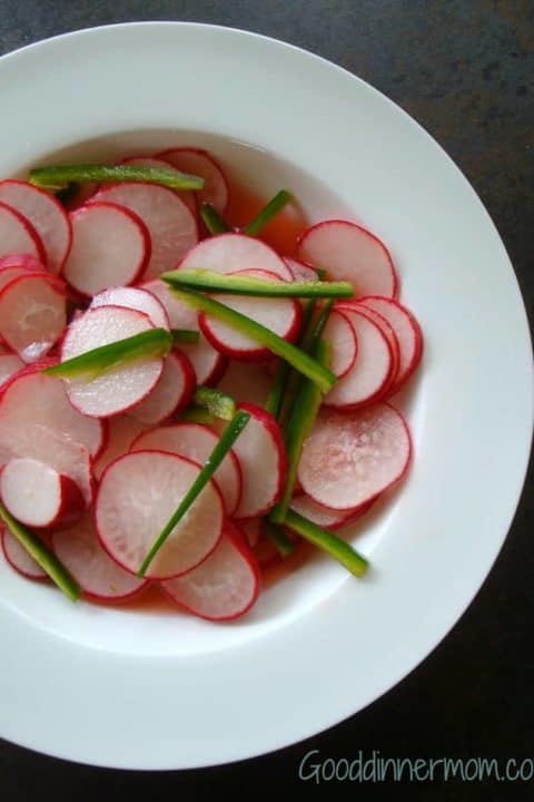 Spicy Pickled Radishes with green peppers in a white bowl