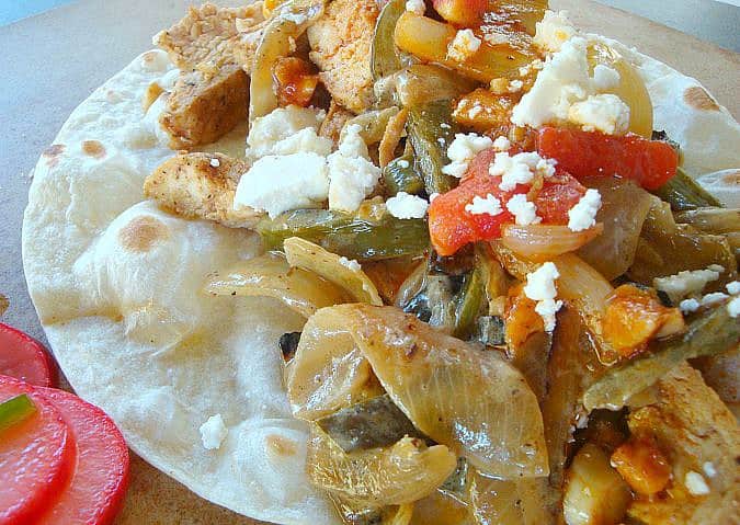 Assembled fajitas with toppings 